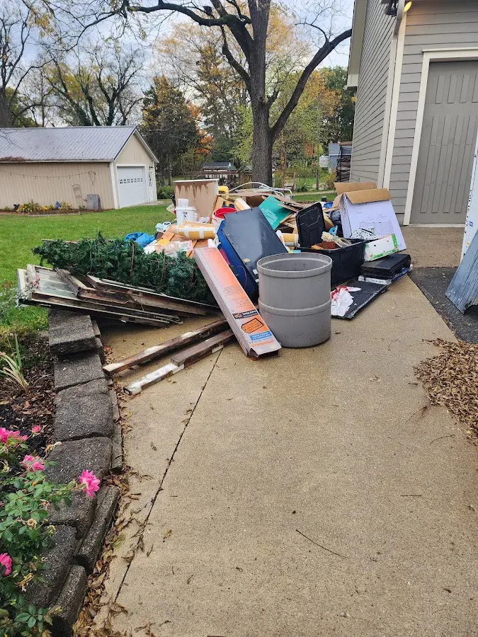 Dumpster being loaded with debris for 3 Yard Dumpster Rental in Rialto